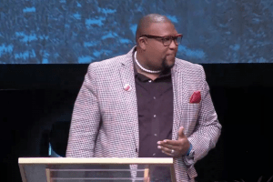 Pastor Dr. David Anderson wears EMBRACE Microphone