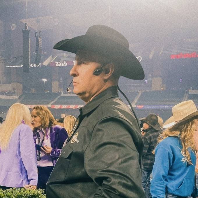 Rodeo Ready_CM-i5 Headset - Hat-Compatible & Noise-Cancelling_Male CM-i5 In-Ear Headset with Cowboy Hat at American Rodeo